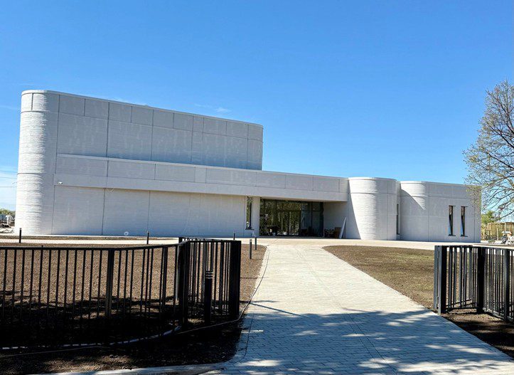 The Mellya Cultural Center — completed white 3D-printed public building with curved walls