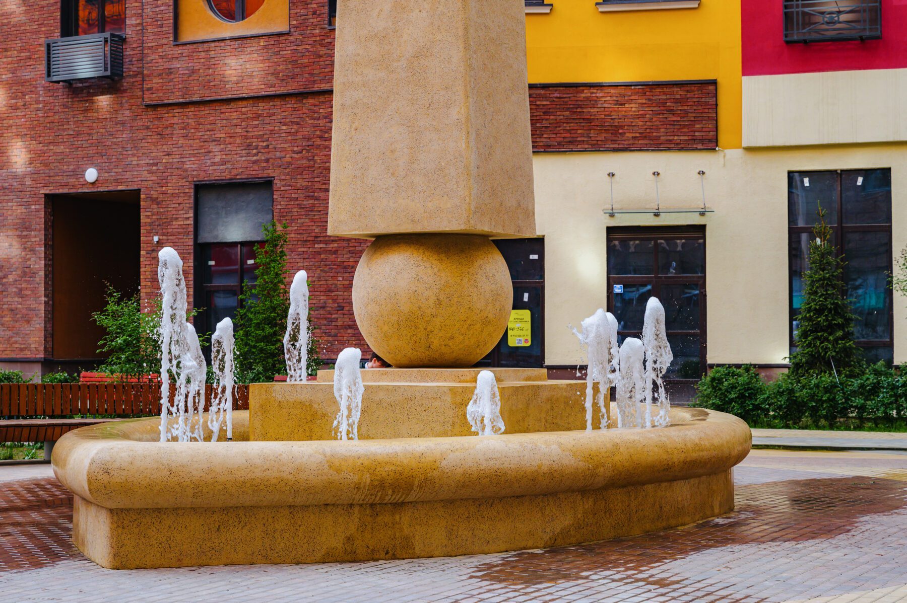 The Monumental Fountain — tiered 3D-printed concrete fountain in a residential courtyard