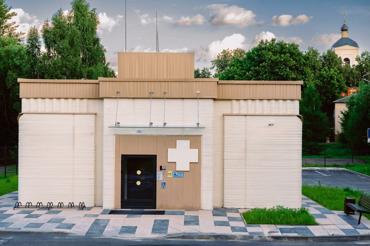 Completed 3D-printed medical clinic with layered facade walls